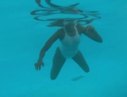 See-through blanched swimsuit in public pool